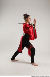 Woman Adult Average Fighting with sword Standing poses Coat Latino